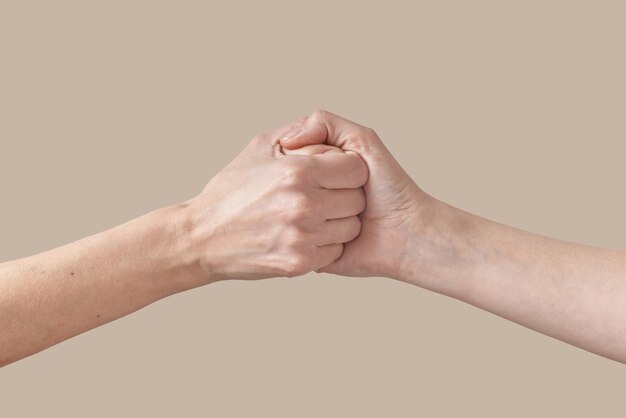 Two female handshake or arm wrestling