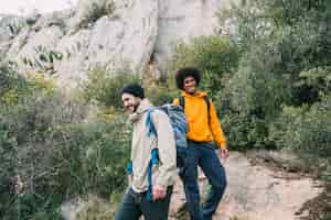 Free photo two friends hiking together