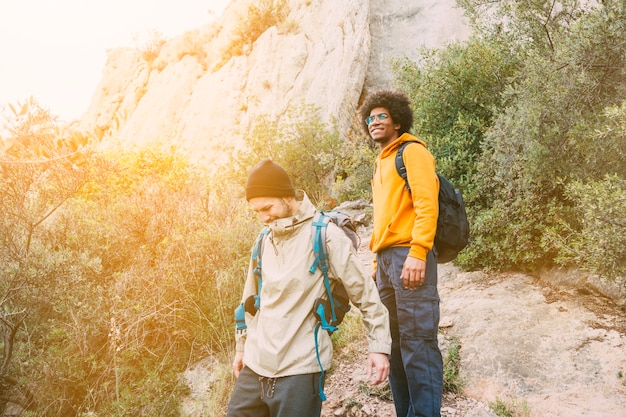 Free photo two friends hiking together