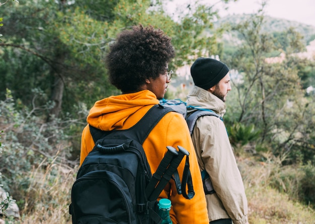 Free photo two friends hiking together