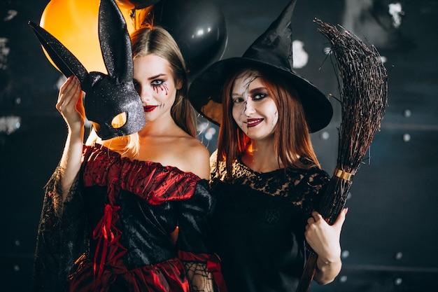 Two girls in halloween costumes