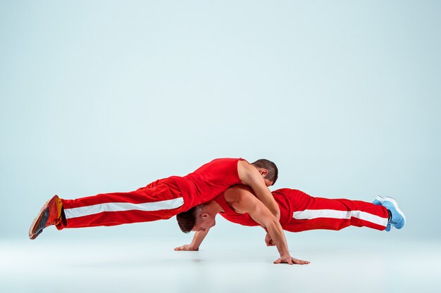 two gymnastic acrobatic caucasian men on balance pose