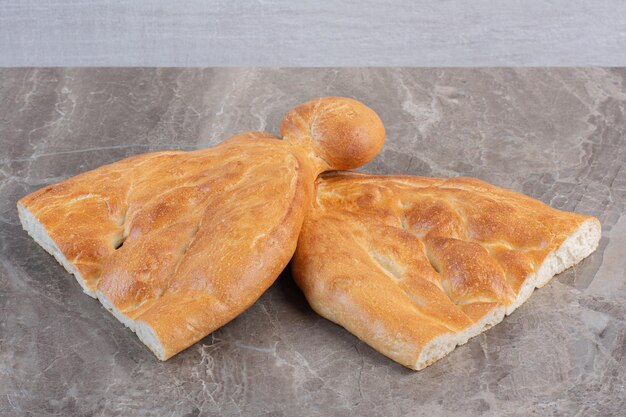 Two half-loaves of tandoori bread on marble background. High quality photo