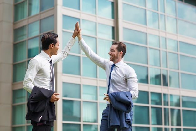 Two Happy Adult Business Men High Fiving