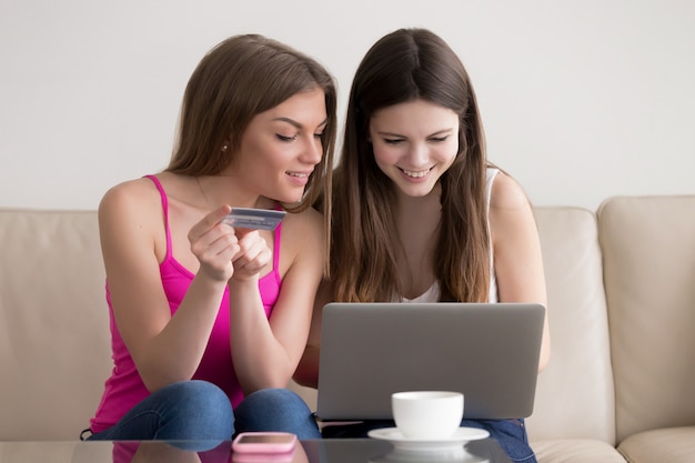 Free Photo two happy girlfriend ordering goods in internet