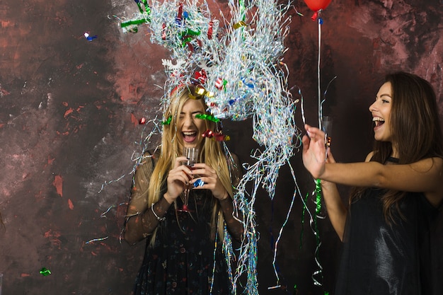 Free photo two happy girls celebrating new year