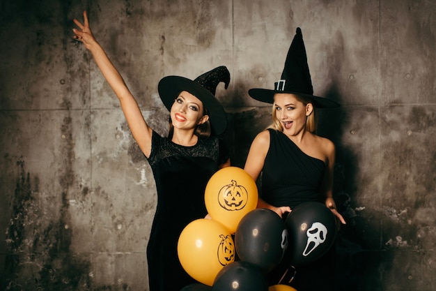 Free photo two happy-looking witches