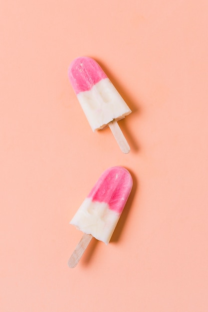 Two ice creams on stick