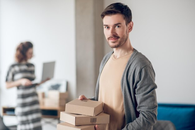 Two Internet shop workers handling their office tasks