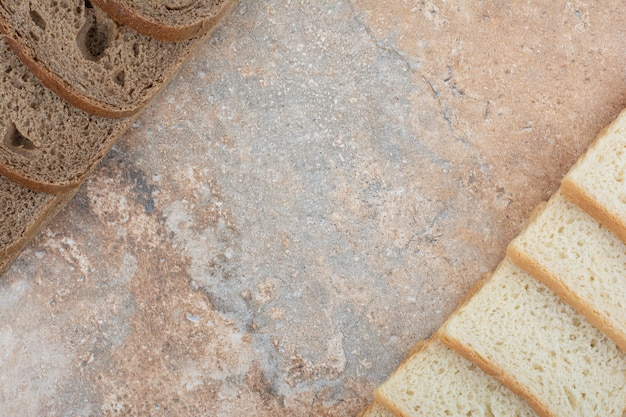 Two kinds of toast bread on marble background