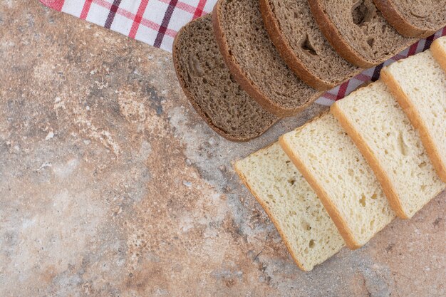 Two kinds of toast bread on tablecloth