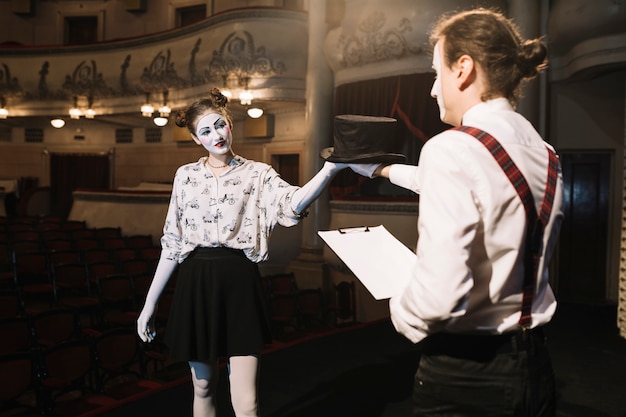 Free Photo two male and female mime artist rehearsing on stage