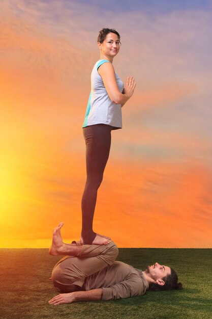 two people doing yoga exercises