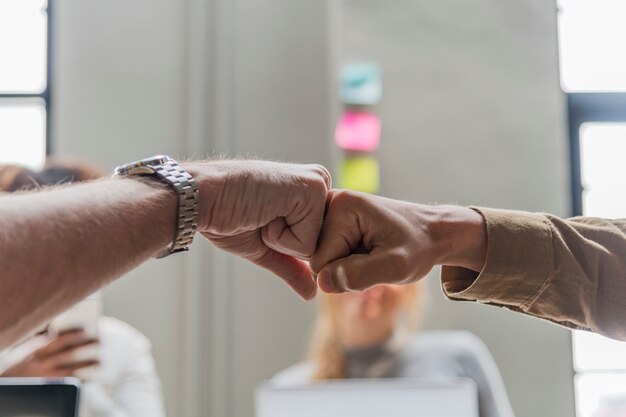 Two people giving a fist bump