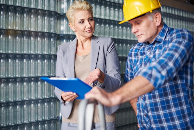 Two people working in warehouse