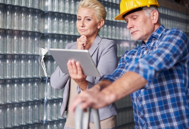 Two people working in warehouse