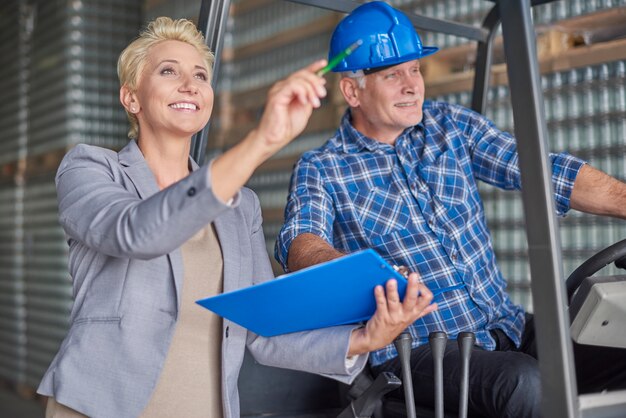 Two people working in warehouse