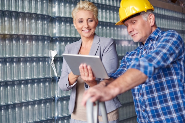 Two people working in warehouse