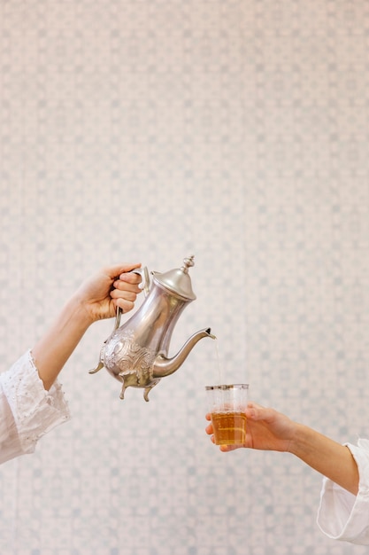 Free photo two persons drinking arab tea