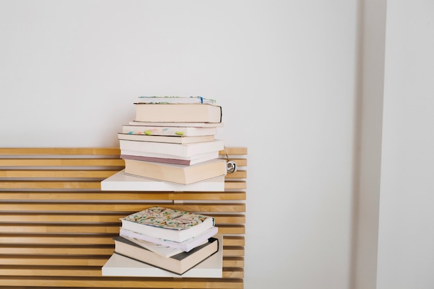 Two piles of books and notebooks