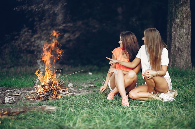 Free Photo two pretty girls in a summer park