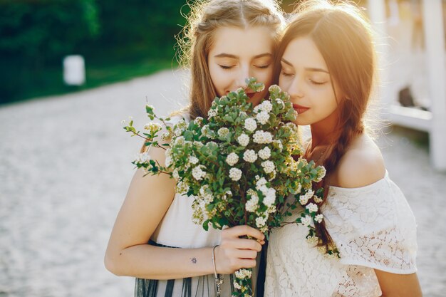 Two pretty girls in a summer park