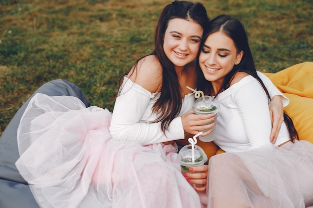 Two pretty girls in a summer park