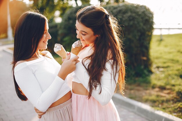 Two pretty girls in a summer park