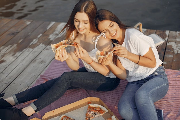 Two pretty girls in a summer park