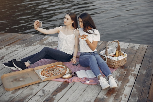 Two pretty girls in a summer park