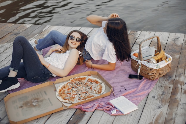 Two pretty girls in a summer park