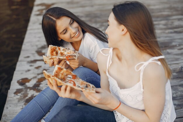 Two pretty girls in a summer park