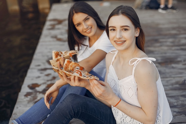 Free photo two pretty girls in a summer park