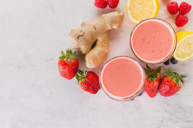 Free photo two red smoothies with strawberries