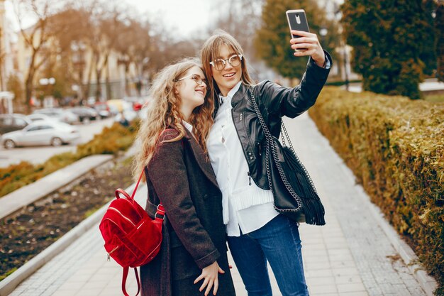 two stylish girl in a city