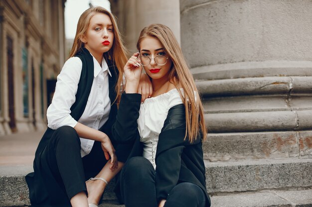 Two stylish girls in a summer city