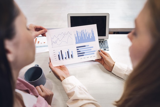 Two women entrepreneurs working together in office