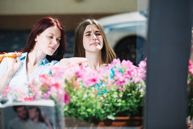 Two women looking at flowers