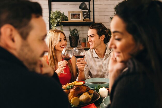 Two young couples at christmas dinner