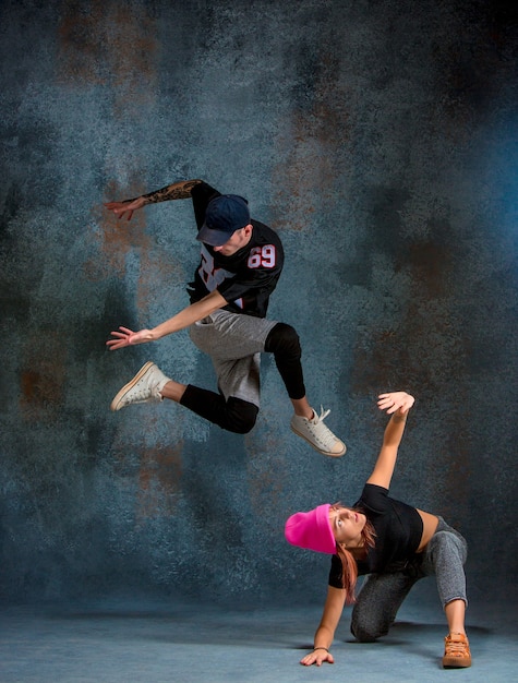 Free Photo the two young girl and boy dancing hip hop 