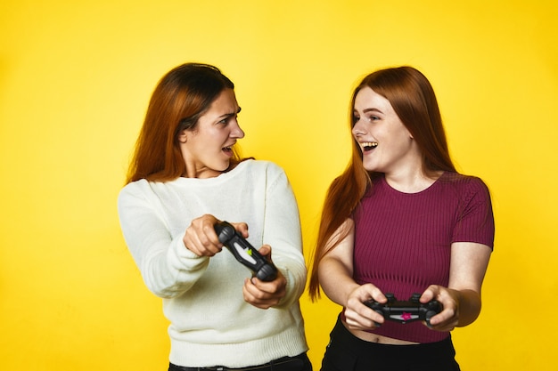 Free Photo two young girls are playing a game 