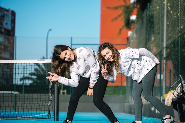 Two young girls playing on rooftop