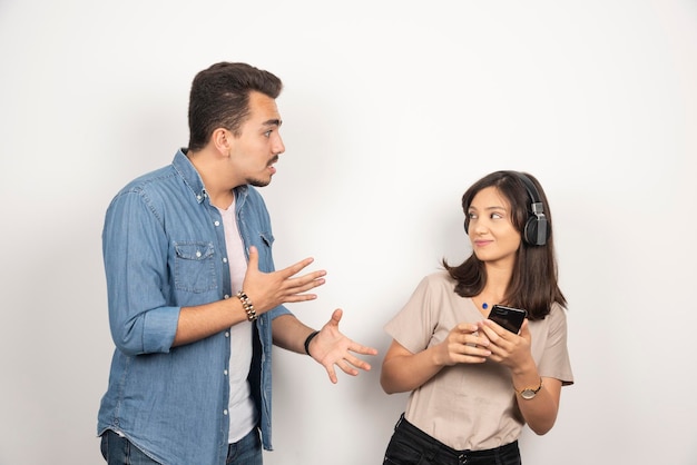 Free photo two young people having argue about music.