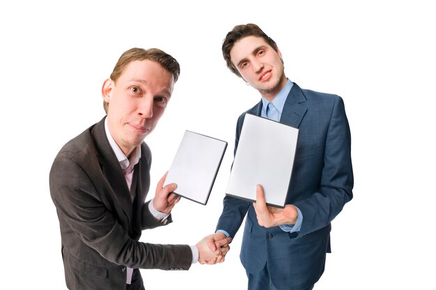 Two young people offering DVDs for sale