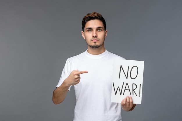 Ukraine russian conflict cute handsome guy in white shirt with no war sign