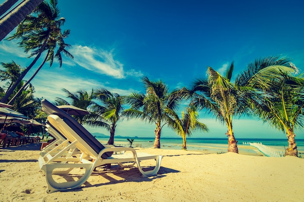 Free photo umbrella and chair around beach and sea for travel and vacation