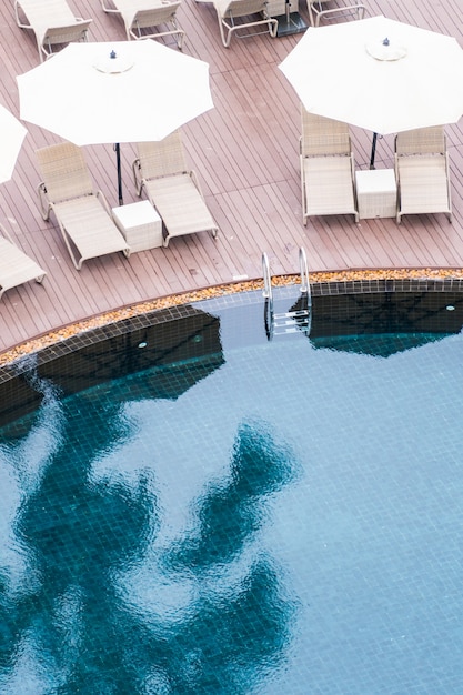 Free Photo umbrella and chair around swimming pool