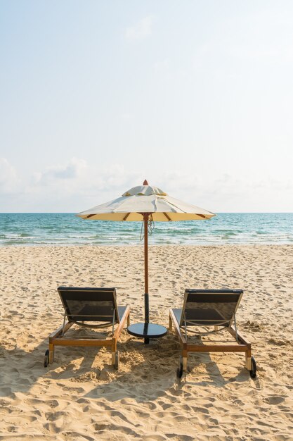 Umbrella and chair on the beach and sea