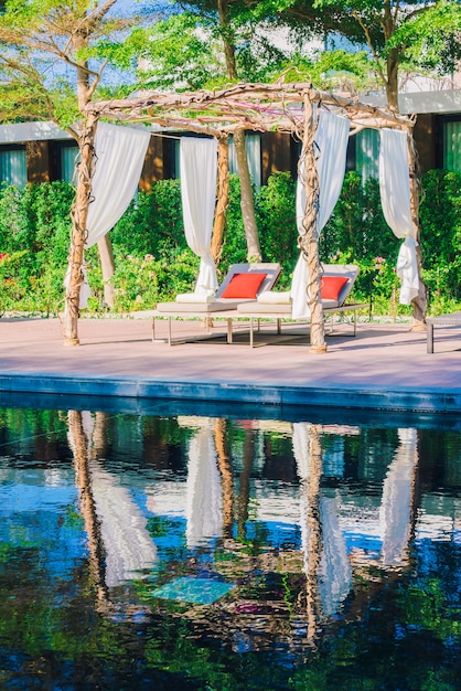 Free photo umbrella pool and chair