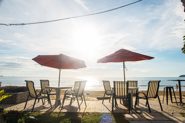 Umbrella tables in the sunset